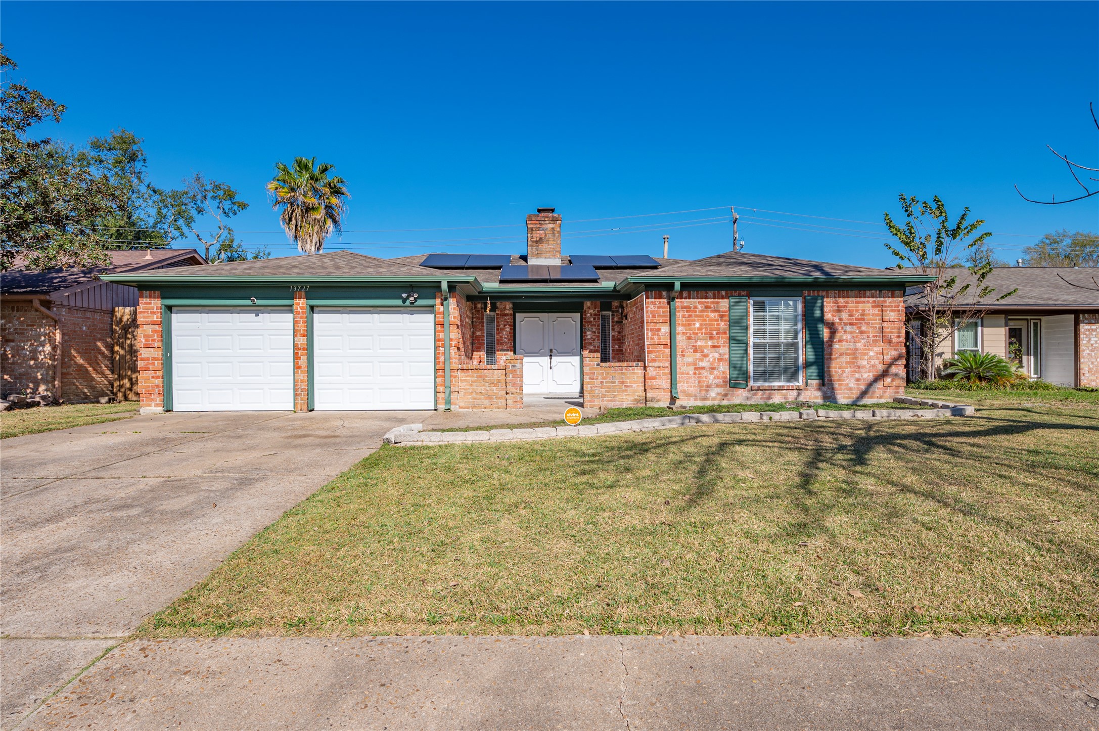 13727 Oleoke Lane Houston, TX 77015 - Photo 2 of 42 a front view of a house with a yard