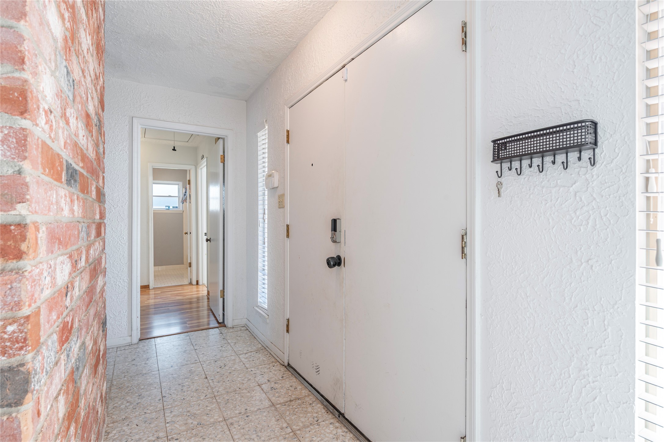 13727 Oleoke Lane Houston, TX 77015 - Photo 3 of 42 a view of a hallway with wooden floor