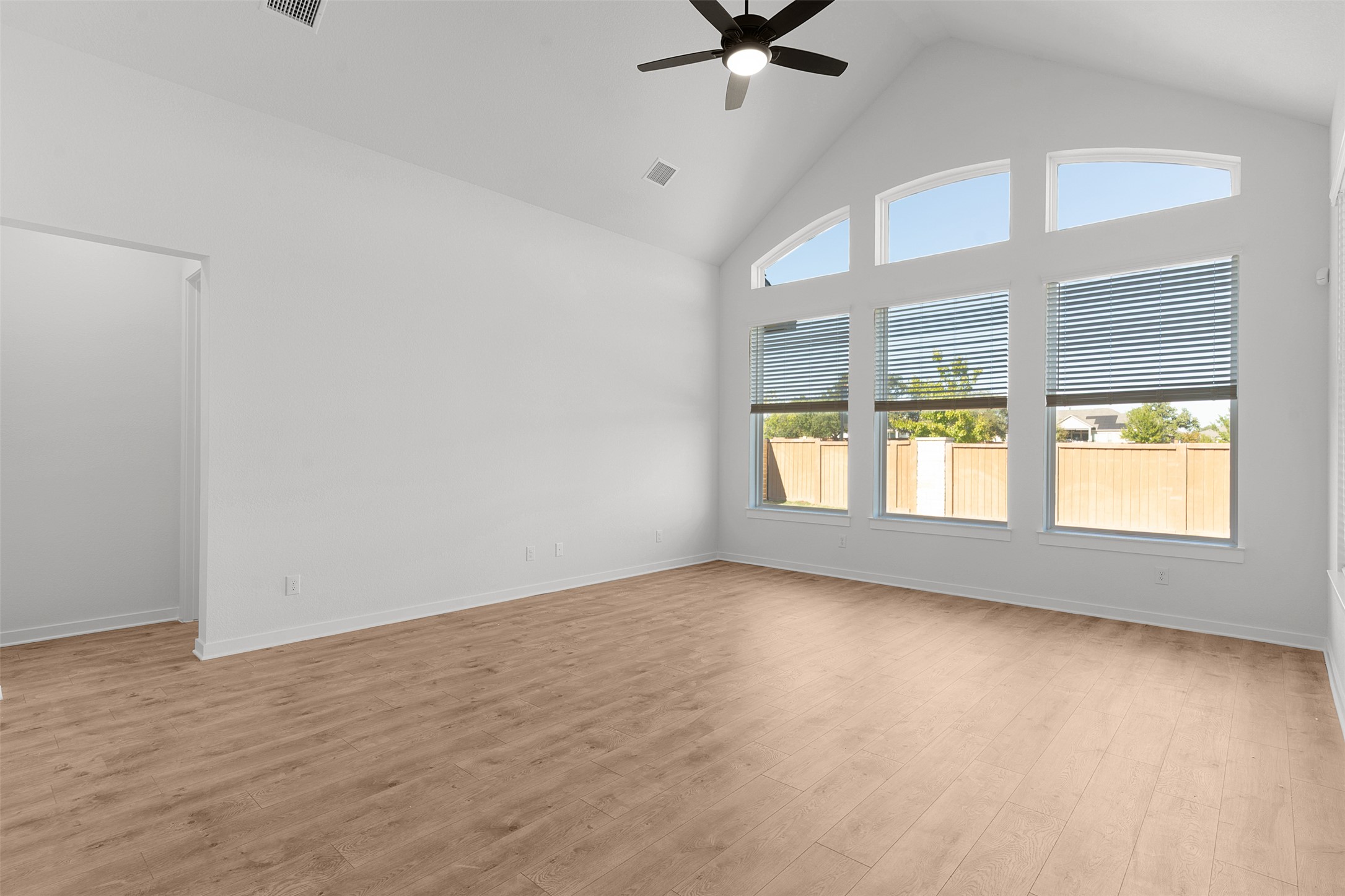 328 Ridgewell Loop Georgetown, TX 78633 - Photo 15 of 28 Spare room with high vaulted ceiling, light wood-style flooring, and ceiling fan