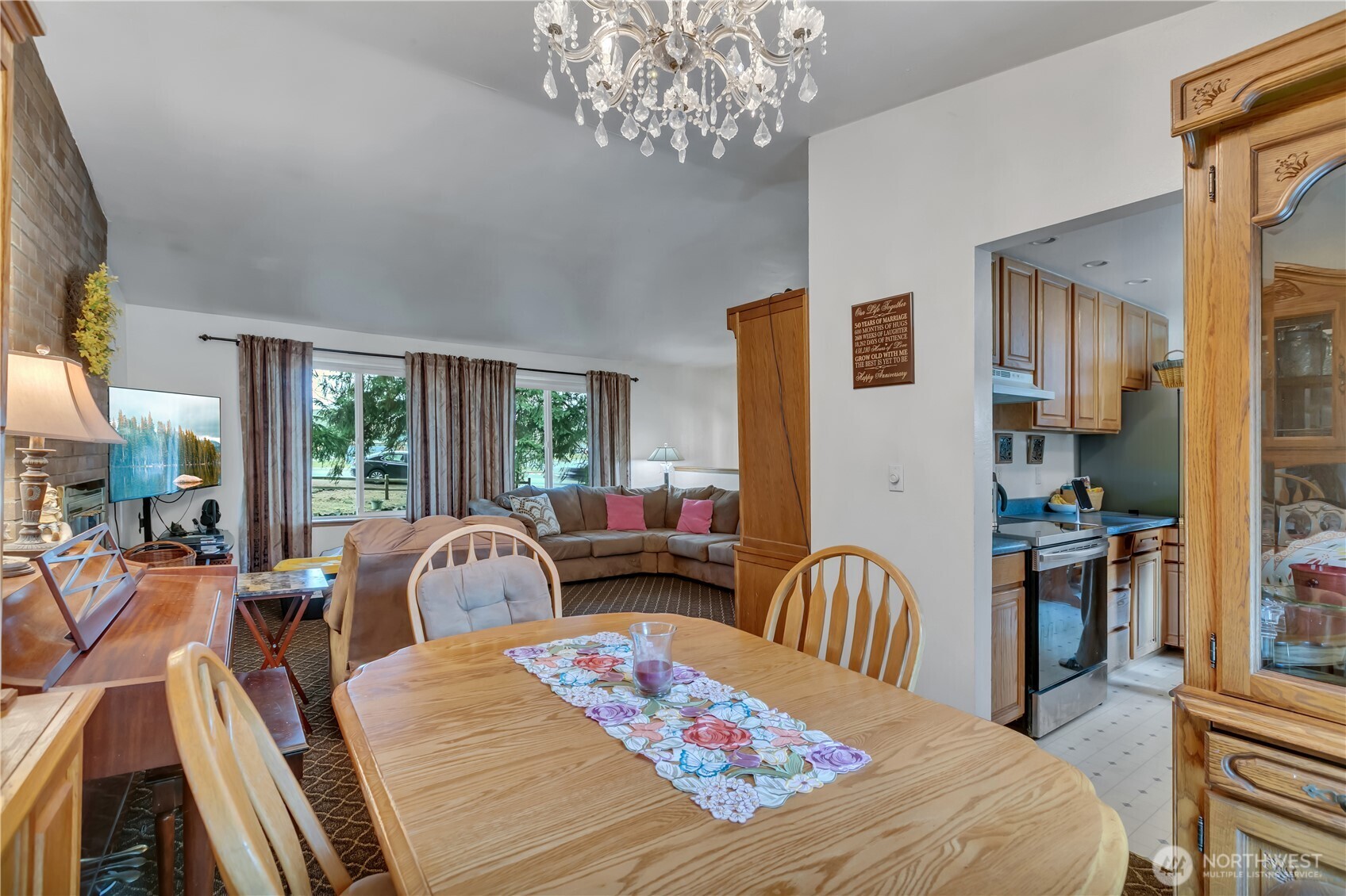 7316 Eustis Hunt Road Spanaway, WA 98387 - Photo 11 of 32 a living room with furniture two large window and wooden floor