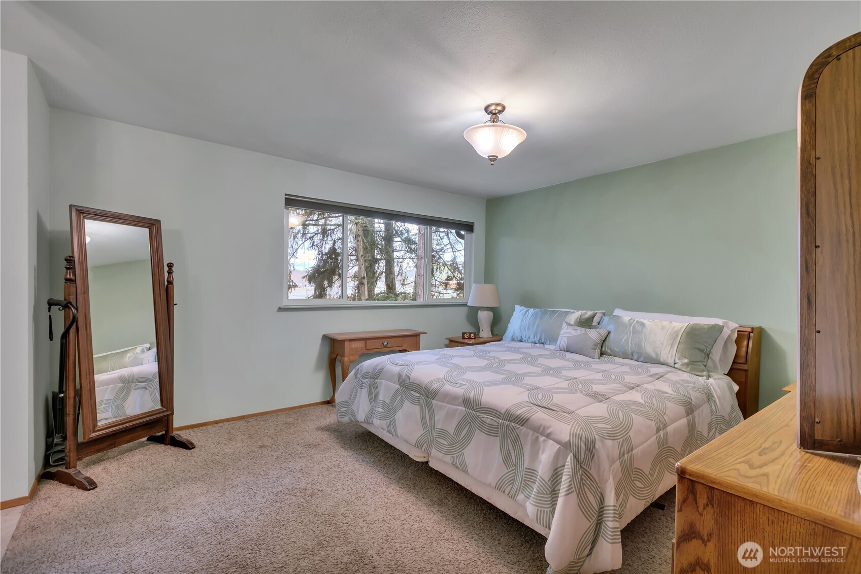 7316 Eustis Hunt Road Spanaway, WA 98387 - Photo 14 of 32 a bedroom with a bed and a window