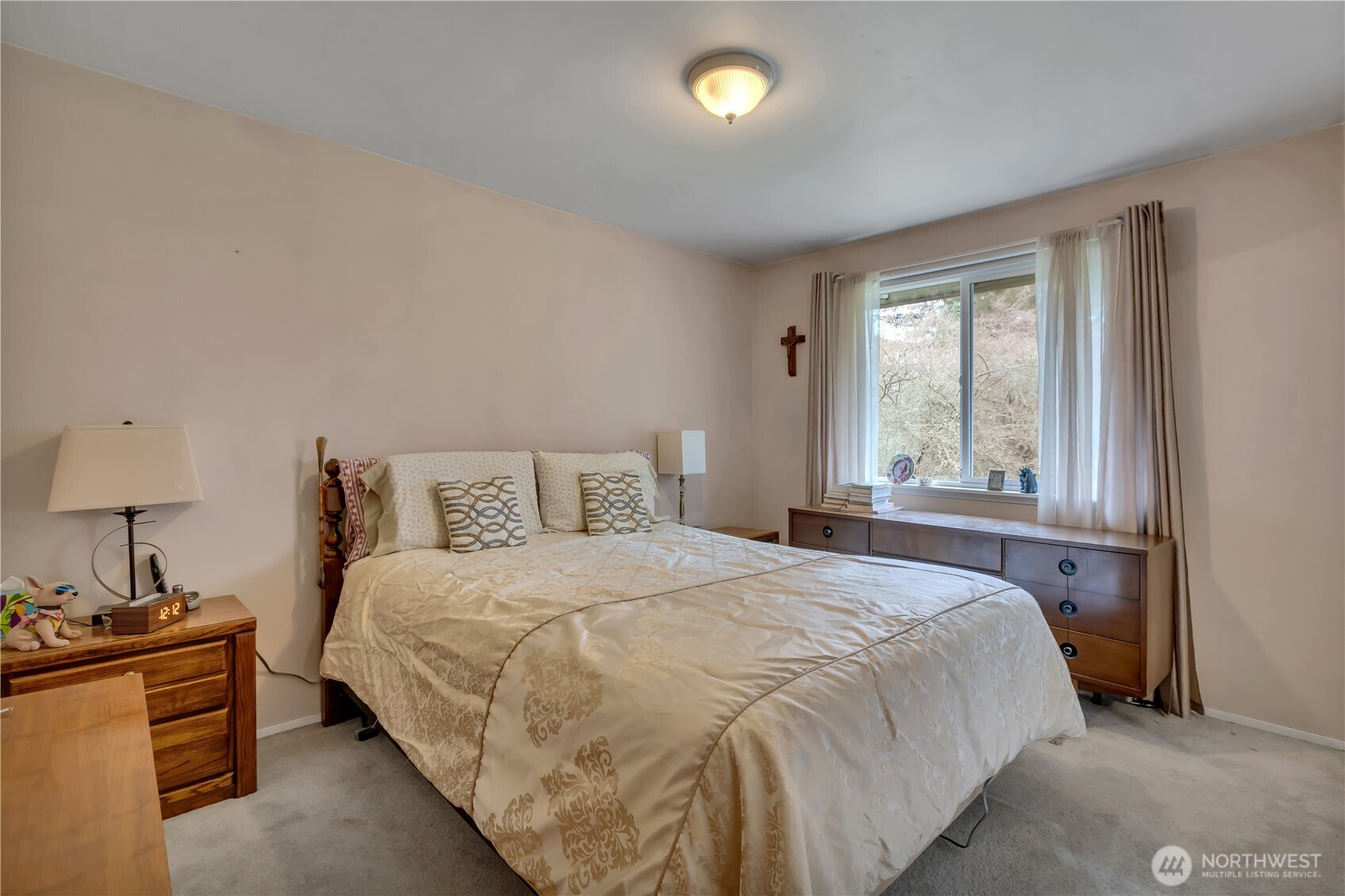 7316 Eustis Hunt Road Spanaway, WA 98387 - Photo 17 of 32 a bedroom with a bed and a window