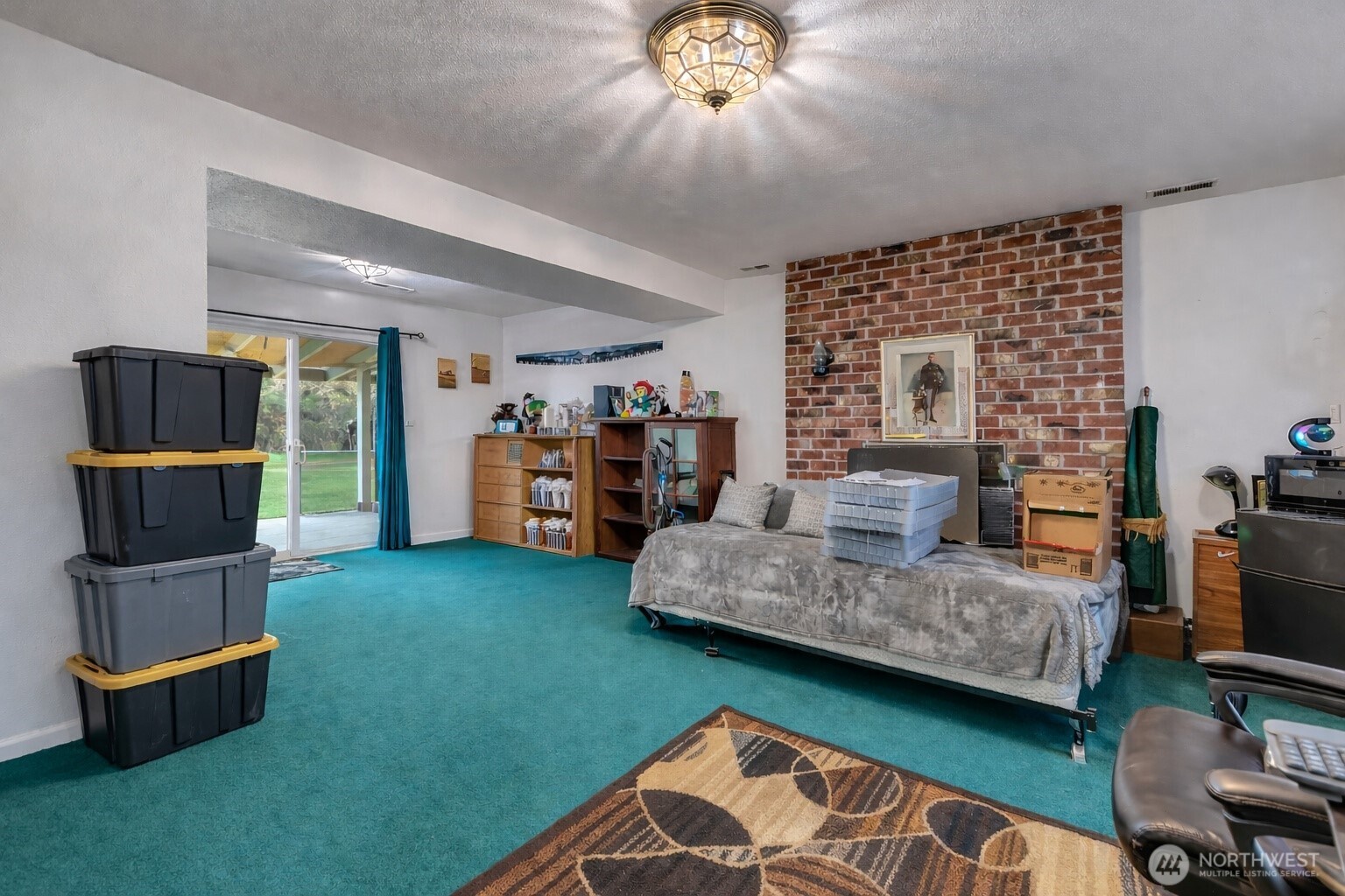 7316 Eustis Hunt Road Spanaway, WA 98387 - Photo 20 of 32 a living room with furniture and a flat screen tv