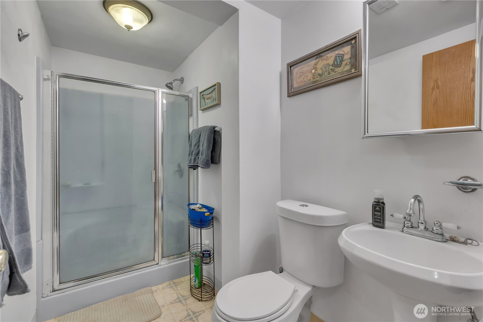 7316 Eustis Hunt Road Spanaway, WA 98387 - Photo 23 of 32 a white toilet sitting next to a bathroom sink