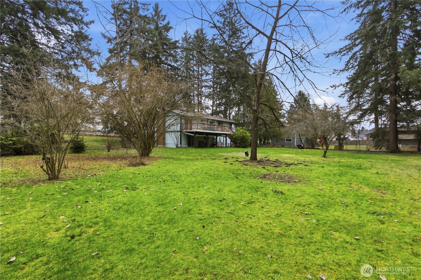 7316 Eustis Hunt Road Spanaway, WA 98387 - Photo 29 of 32 a view of a house with a yard