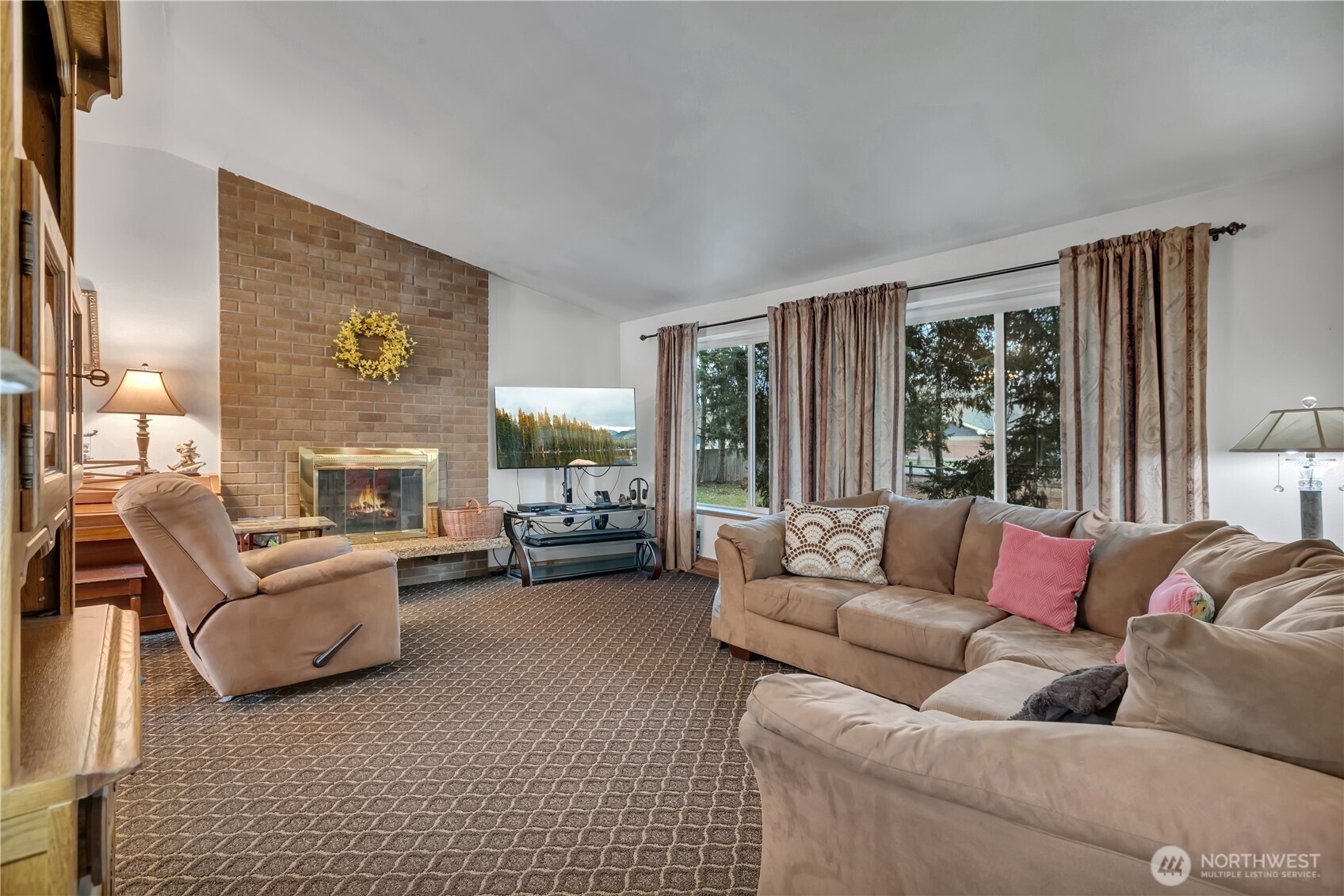 7316 Eustis Hunt Road Spanaway, WA 98387 - Photo 4 of 32 a living room with furniture large window and a fireplace