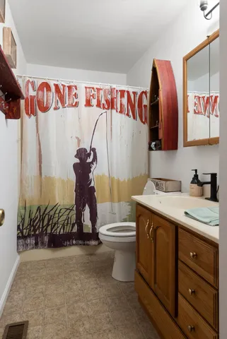 a bedroom with a bed and a television