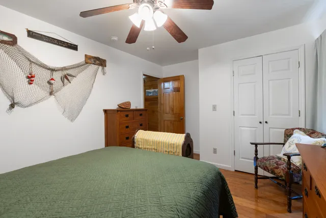 a bedroom with furniture and a bed