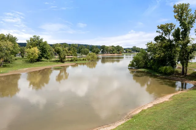 a view of a lake with houses in the back