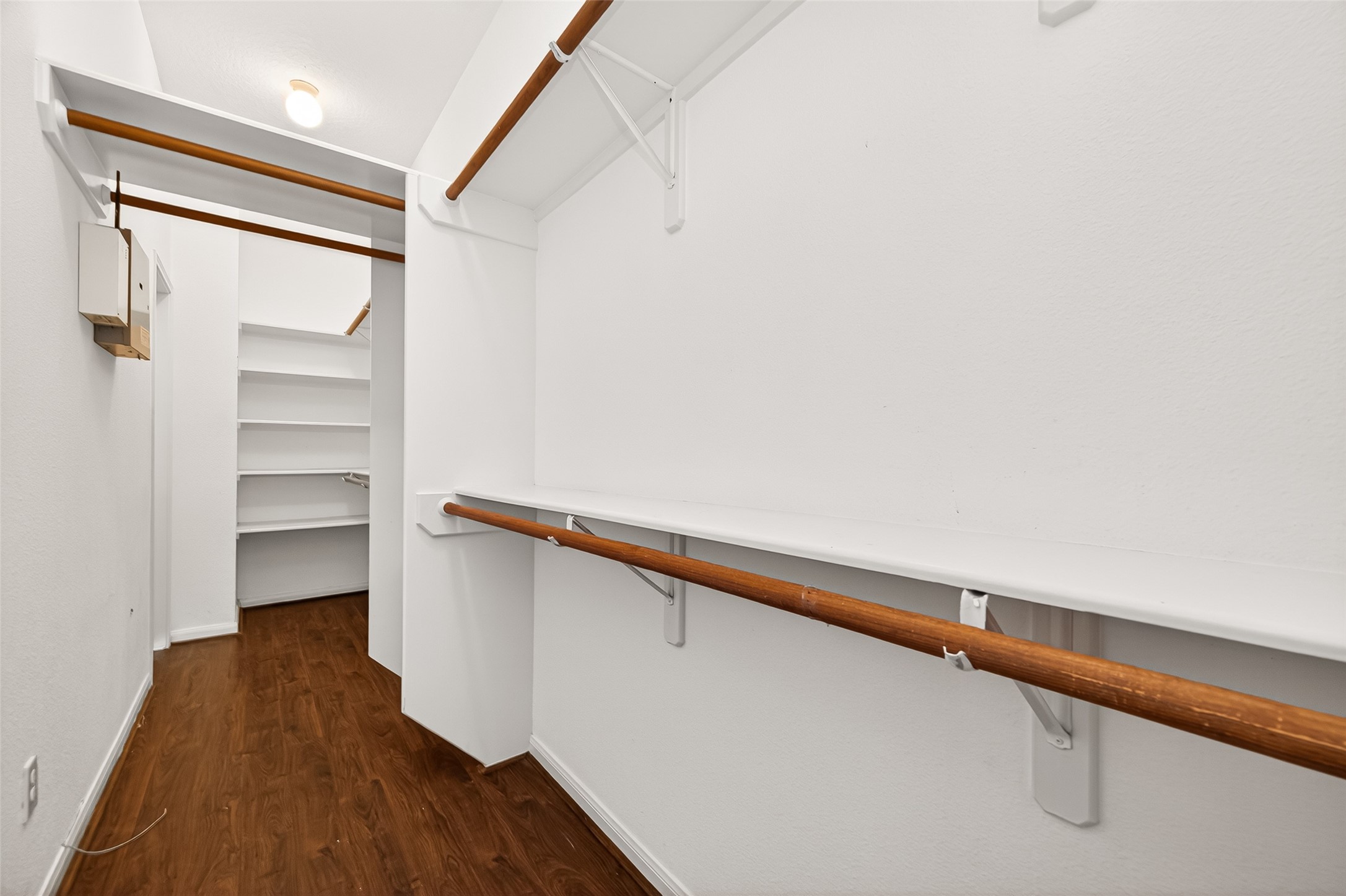 12831 Dove Point Lane Houston, TX 77041 - Photo 36 of 50 a hallway with wooden floor and shoes