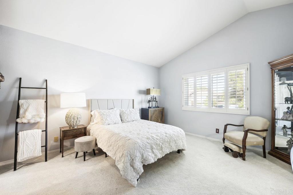 430 Silver Shadow Drive San Marcos, CA 92078 - Photo 18 of 36 a bedroom with a bed and a couch