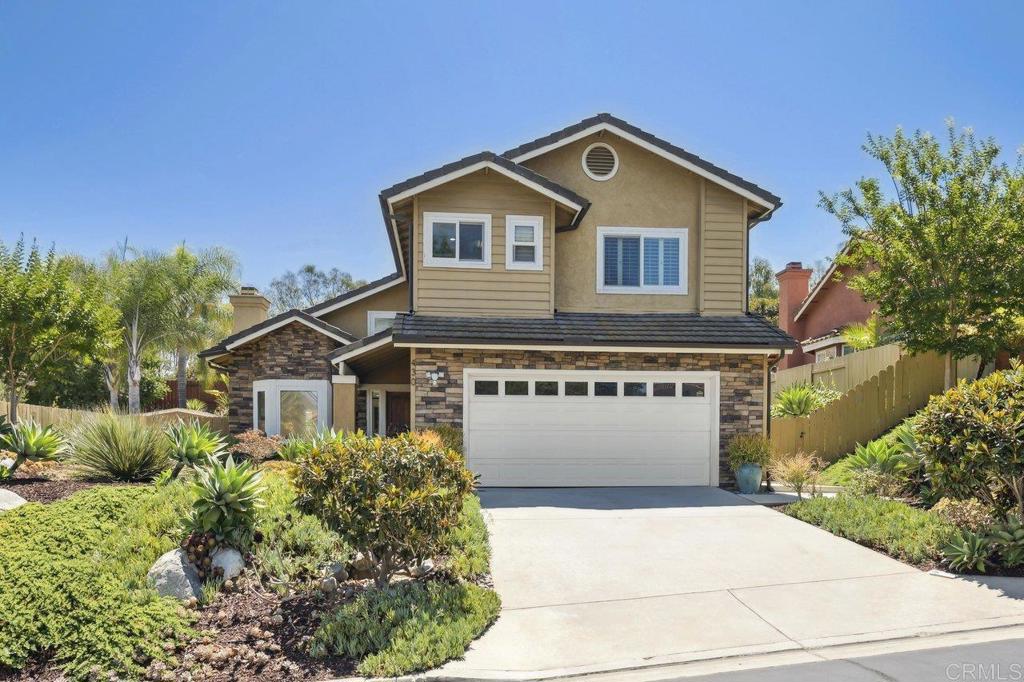 430 Silver Shadow Drive San Marcos, CA 92078 - Photo 2 of 36 a front view of a house with a yard and garage