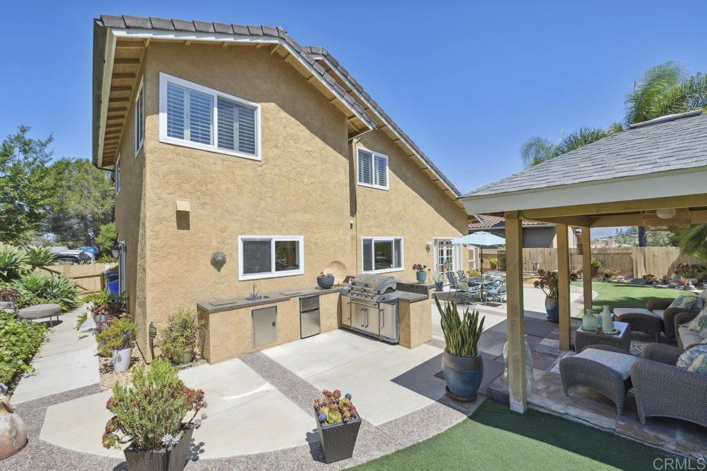 430 Silver Shadow Drive San Marcos, CA 92078 - Photo 29 of 36 a house view with a seating space and garden space