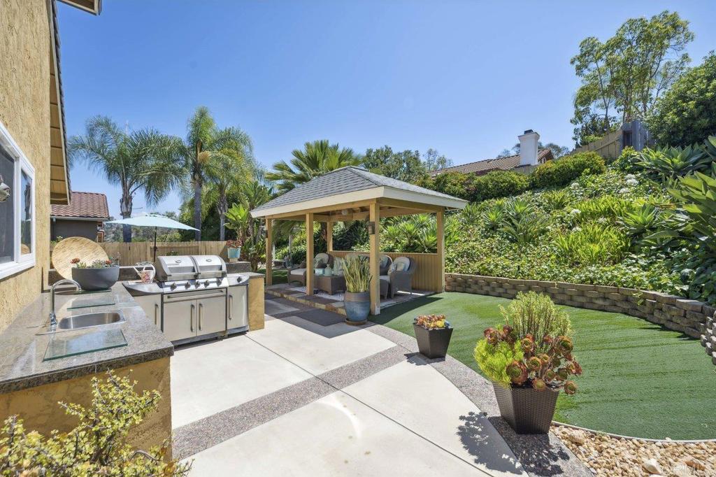 430 Silver Shadow Drive San Marcos, CA 92078 - Photo 30 of 36 a view of a backyard with sitting area and furniture