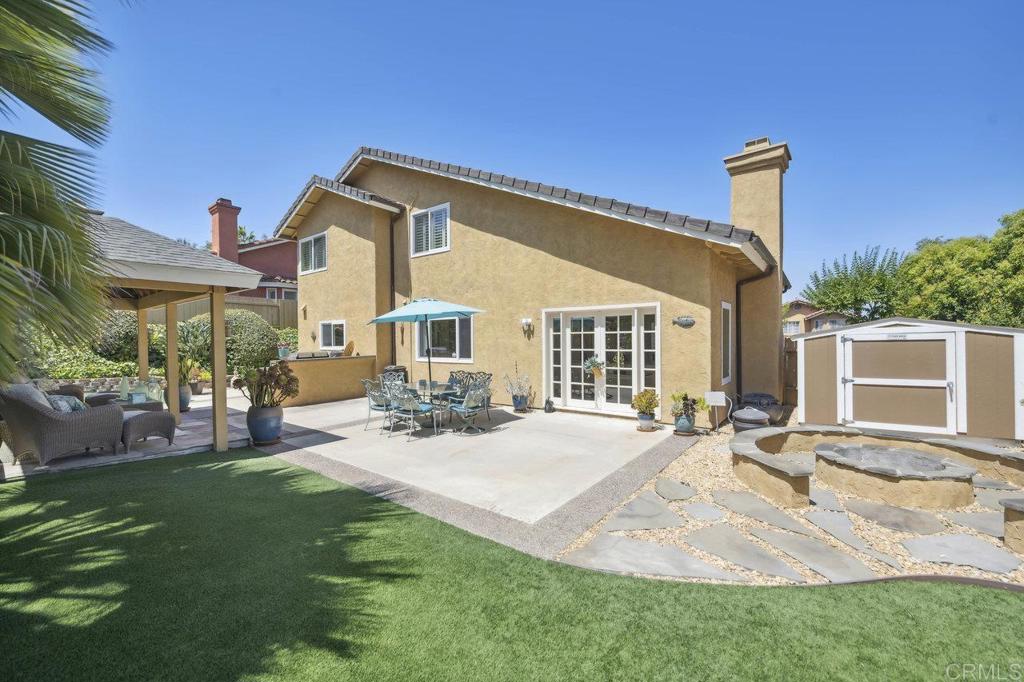 430 Silver Shadow Drive San Marcos, CA 92078 - Photo 33 of 36 a front view of a house with a yard outdoor seating and barbeque oven