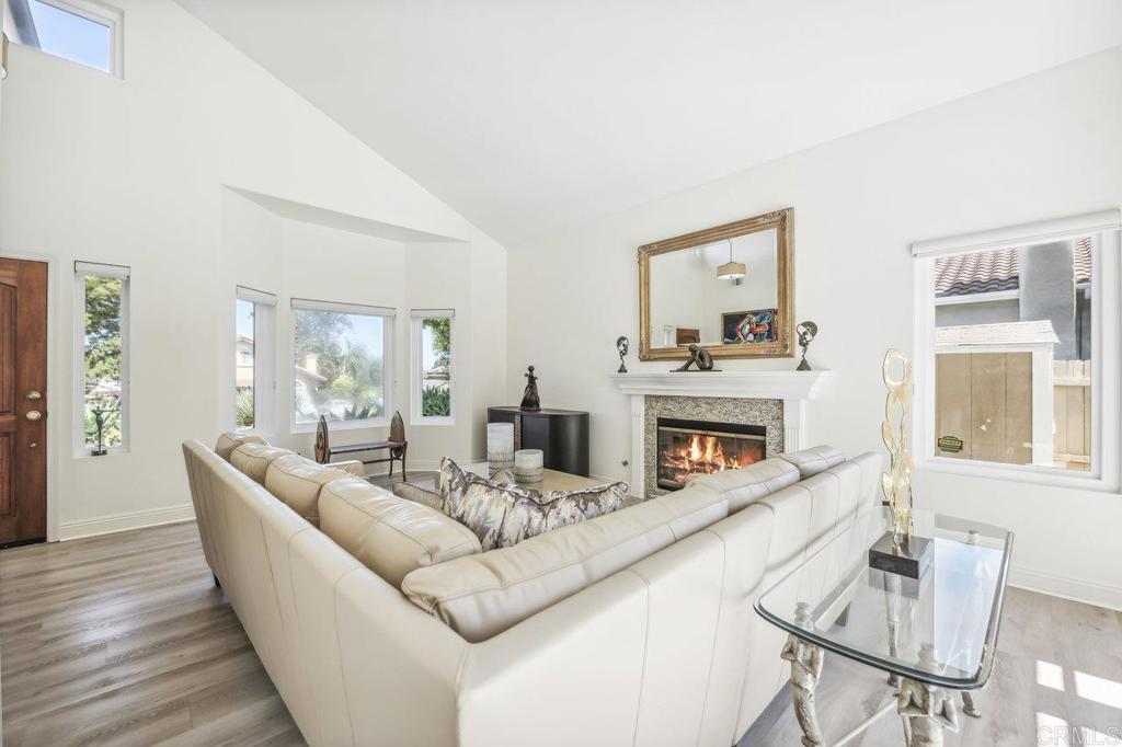 430 Silver Shadow Drive San Marcos, CA 92078 - Photo 4 of 36 a living room with fireplace furniture and a wooden floor