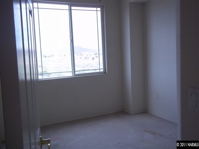 1760 Legacy Village Road Reno, NV 89521 - Photo 8 of 11 an empty room with a window