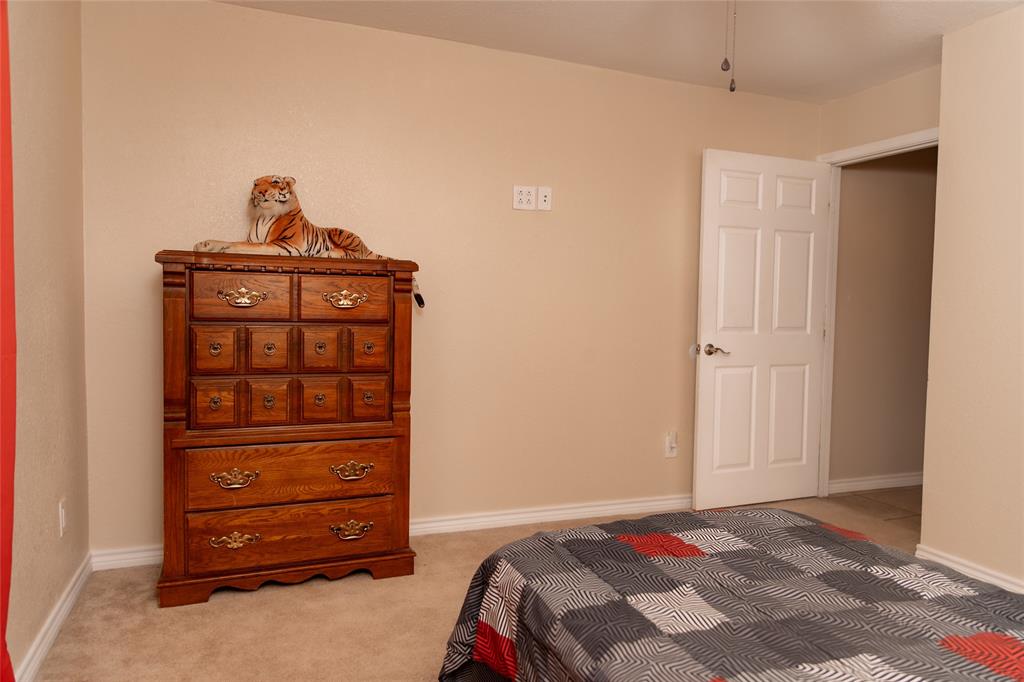 5215 Highway 7 Center, TX 75935 - Photo 16 of 37 Bedroom featuring light carpet and baseboards