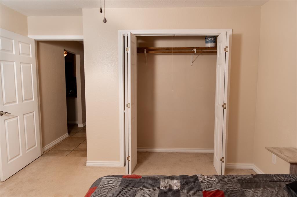 5215 Highway 7 Center, TX 75935 - Photo 18 of 37 Bedroom with light colored carpet and a closet