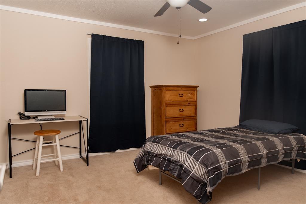 5215 Highway 7 Center, TX 75935 - Photo 10 of 37 Bedroom with light carpet, ornamental molding, recessed lighting, a ceiling fan, and a desk