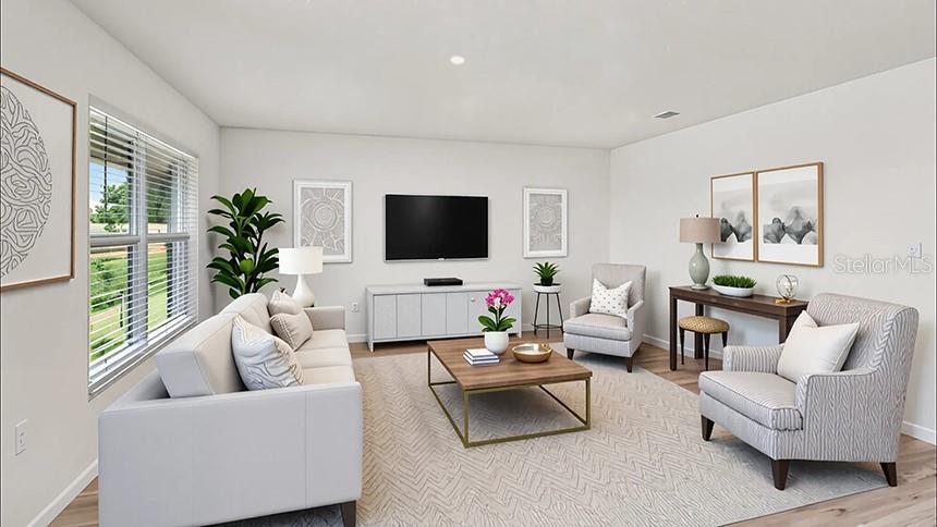 4597 Southwest 88 Place Ocala, FL 34476 - Photo 2 of 12 a living room with furniture flat screen tv and a large window