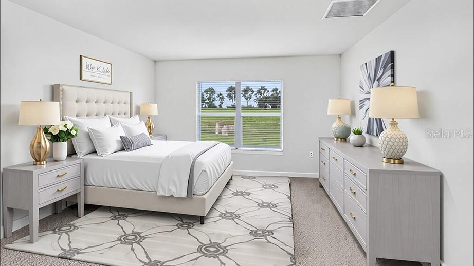 4597 Southwest 88 Place Ocala, FL 34476 - Photo 5 of 12 a spacious bedroom with a large bed and a window