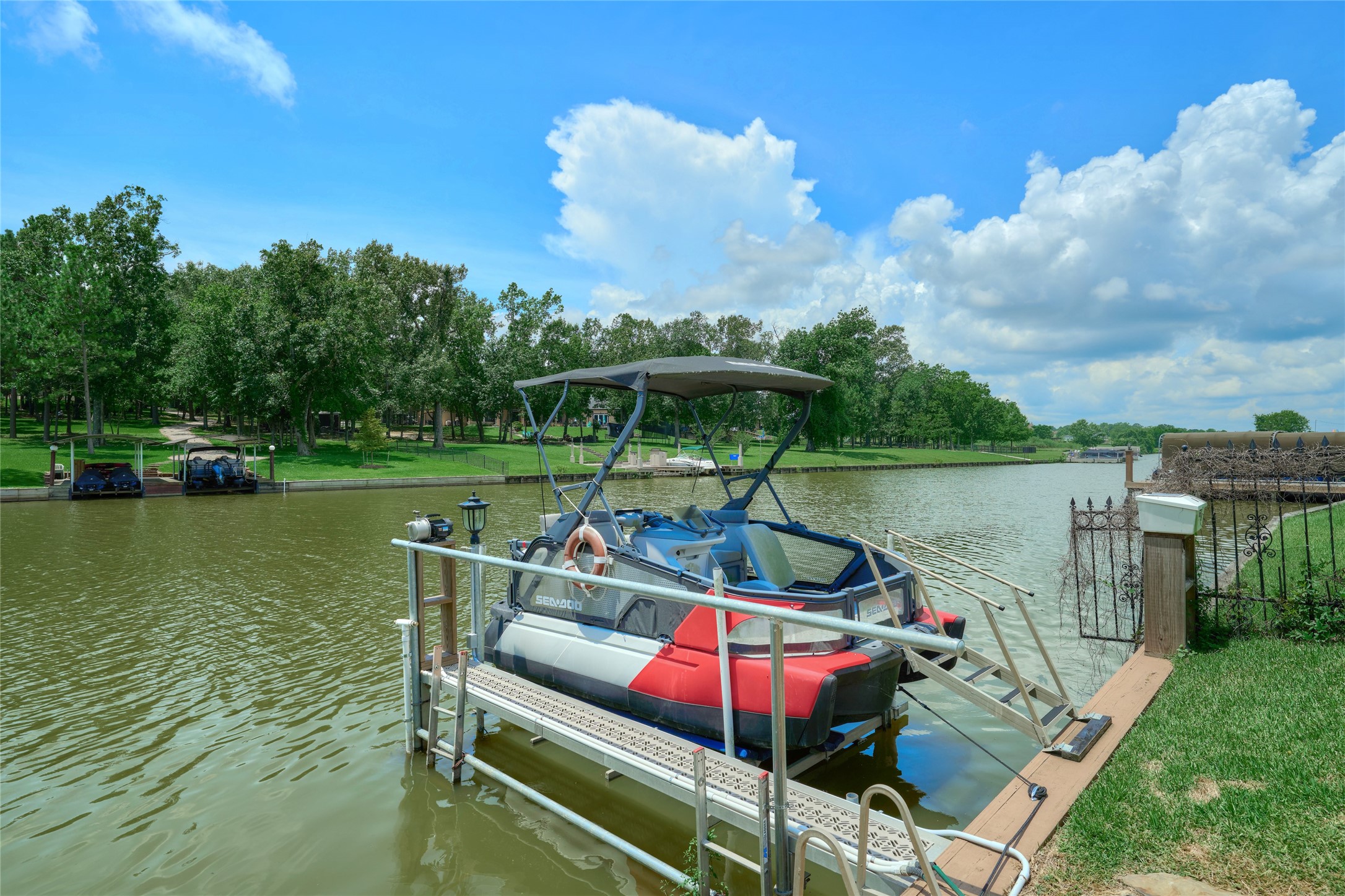 11503 Renaissance Drive Montgomery, TX 77356 - Photo 8 of 50 Boat lift & catwalk was installed in 2022. Sale includes 2022 Sea-Doo Switch Sport Compact - 170 HP. Like brand new - only a few miles on it.