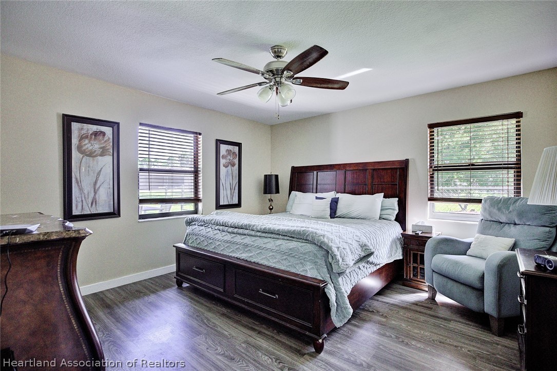 3601 Divot Road Sebring, FL 33872 - Photo 18 of 31 a spacious bedroom with a bed and window