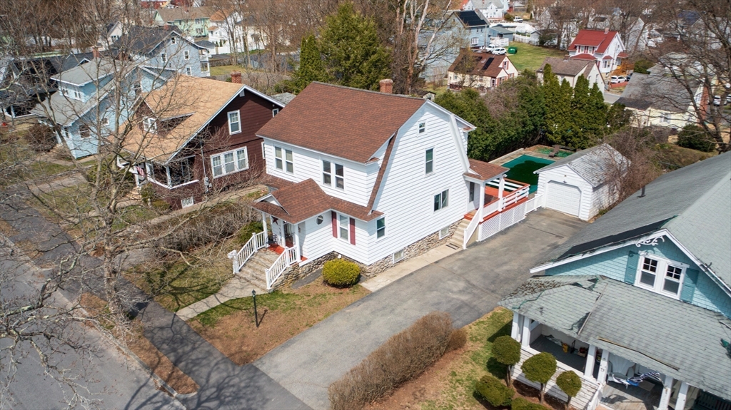 69 Eureka Street Worcester, MA 01603 - Photo 13 of 37 an aerial view of multiple houses with yard