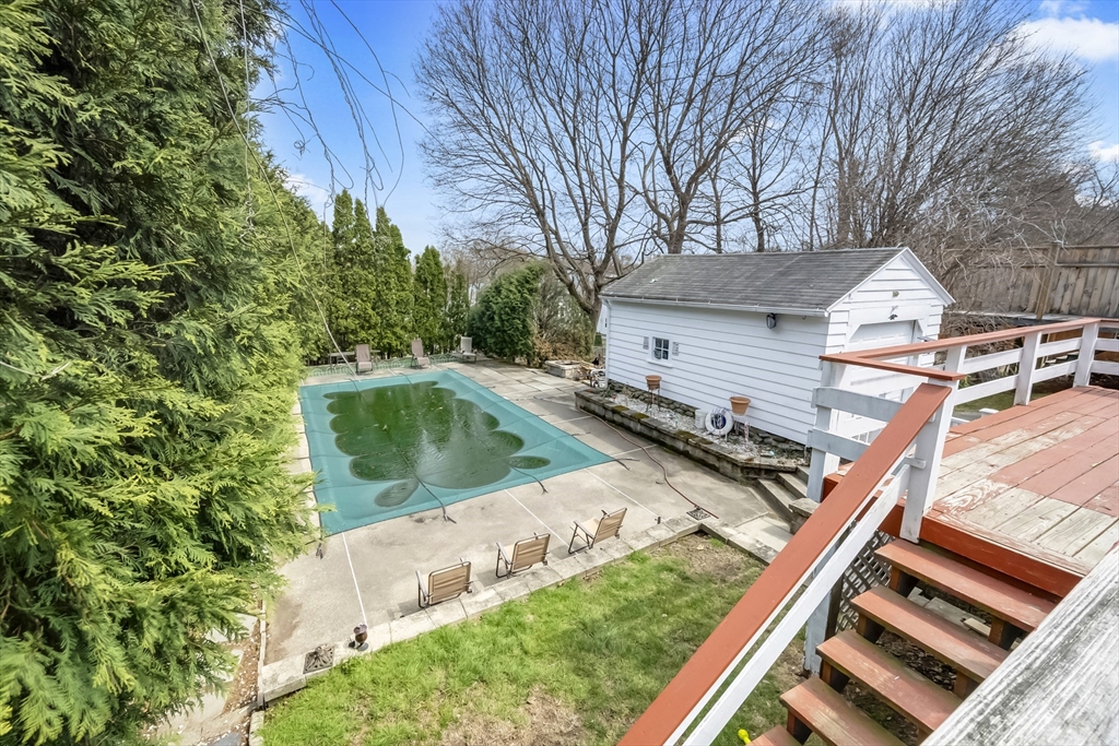 69 Eureka Street Worcester, MA 01603 - Photo 17 of 37 a view of a backyard with plants and a patio