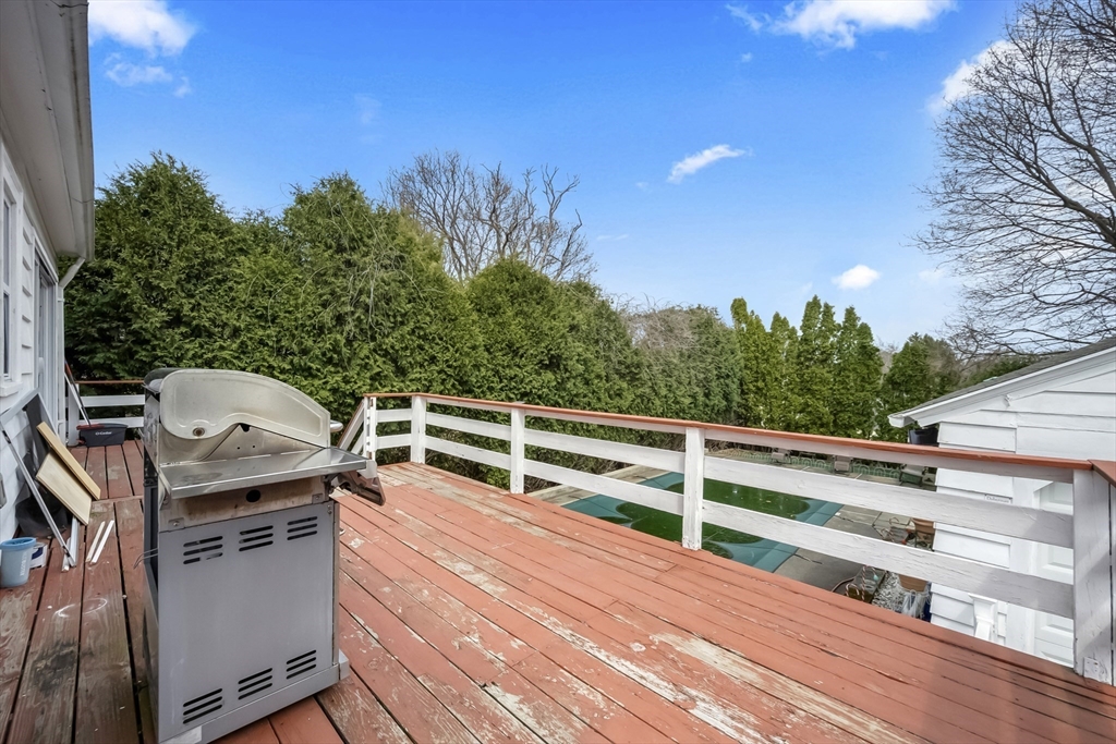 69 Eureka Street Worcester, MA 01603 - Photo 18 of 37 a view of a balcony with wooden floor and fence