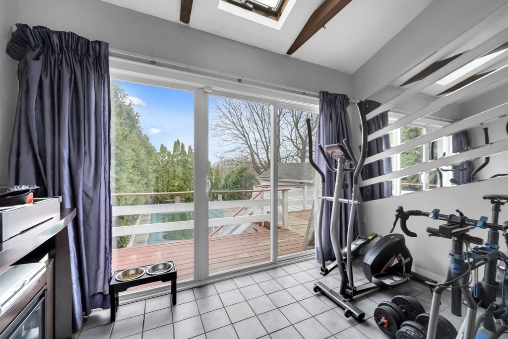 69 Eureka Street Worcester, MA 01603 - Photo 23 of 37 a room with lots of furniture and a large window