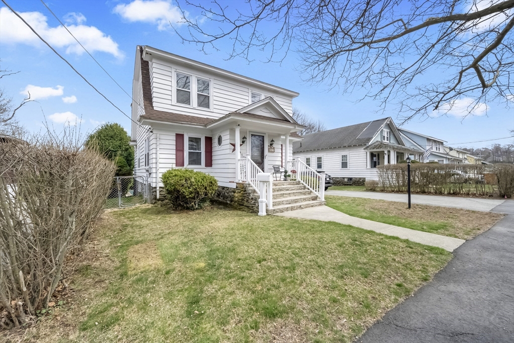 69 Eureka Street Worcester, MA 01603 - Photo 3 of 37 a front view of a house with garden