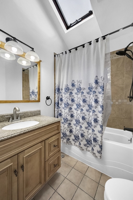 69 Eureka Street Worcester, MA 01603 - Photo 31 of 37 a bathroom with a granite countertop sink toilet and shower