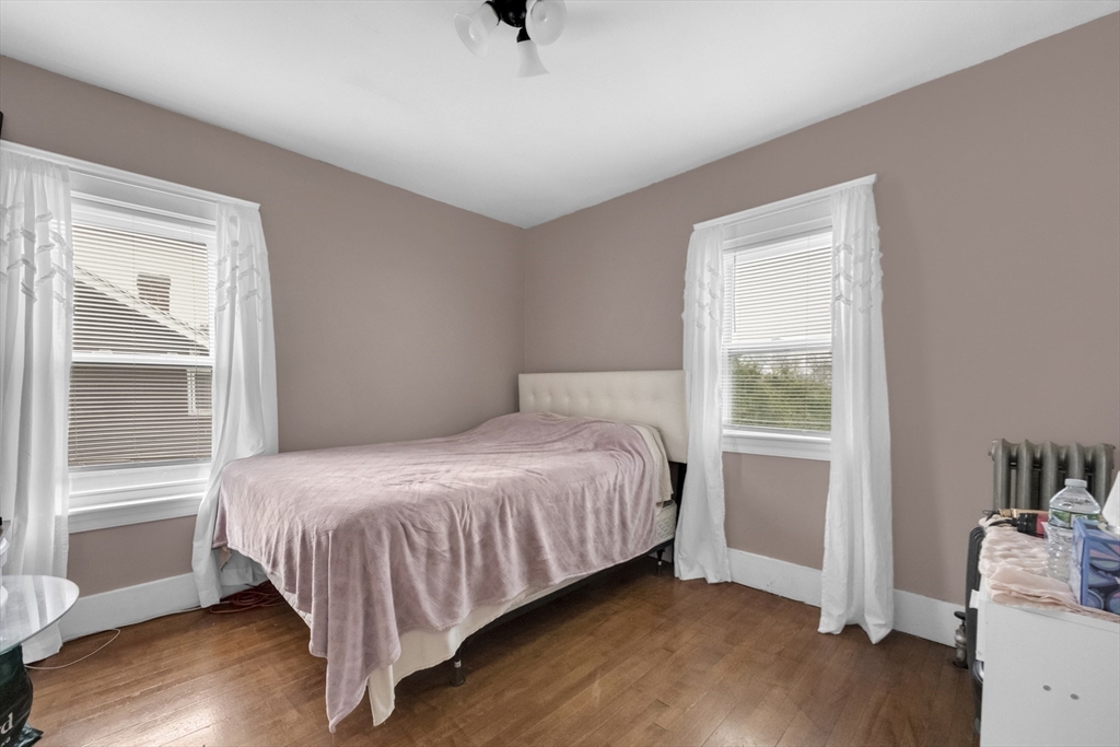 69 Eureka Street Worcester, MA 01603 - Photo 32 of 37 a bedroom with a bed and a window