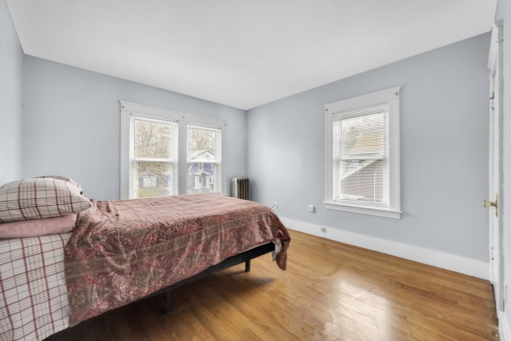 69 Eureka Street Worcester, MA 01603 - Photo 33 of 37 a bedroom with a bed and window