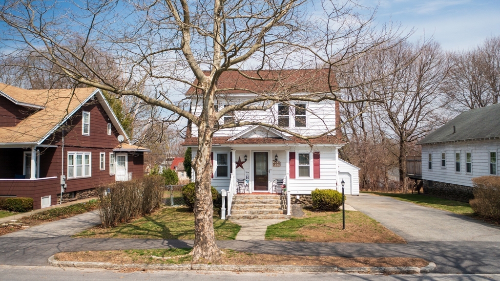 69 Eureka Street Worcester, MA 01603 - Photo 4 of 37 a front view of a house with a yard