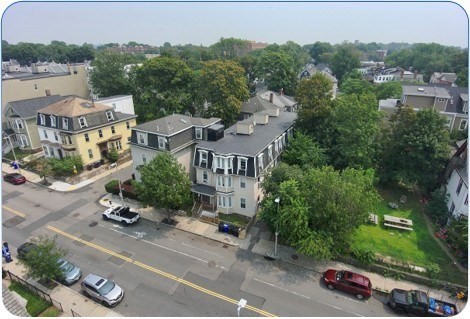 94 Walnut Avenue Boston, MA 02119 - Photo 3 of 9 an aerial view of multiple houses with a street