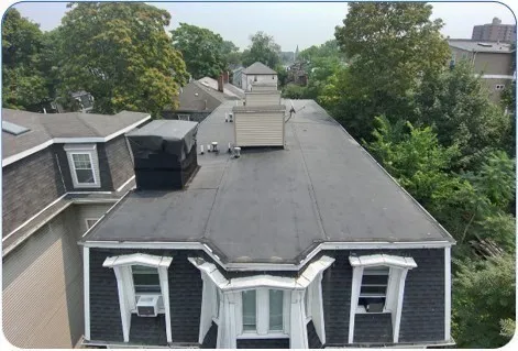 a aerial view of a house with a yard