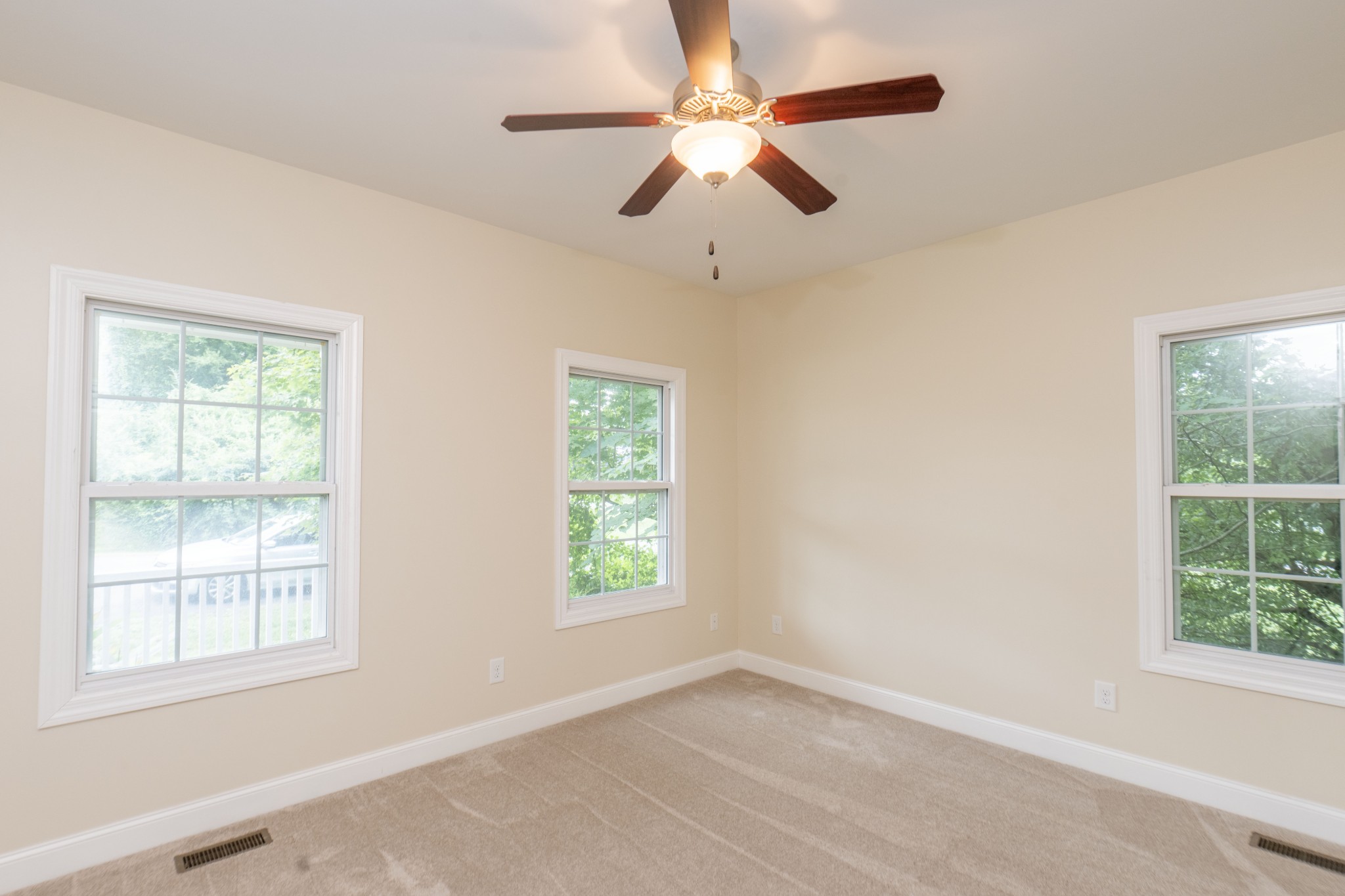 111 Reed's Lane Sewanee, TN 37375 - Photo 19 of 24 an empty room with a window and a fan