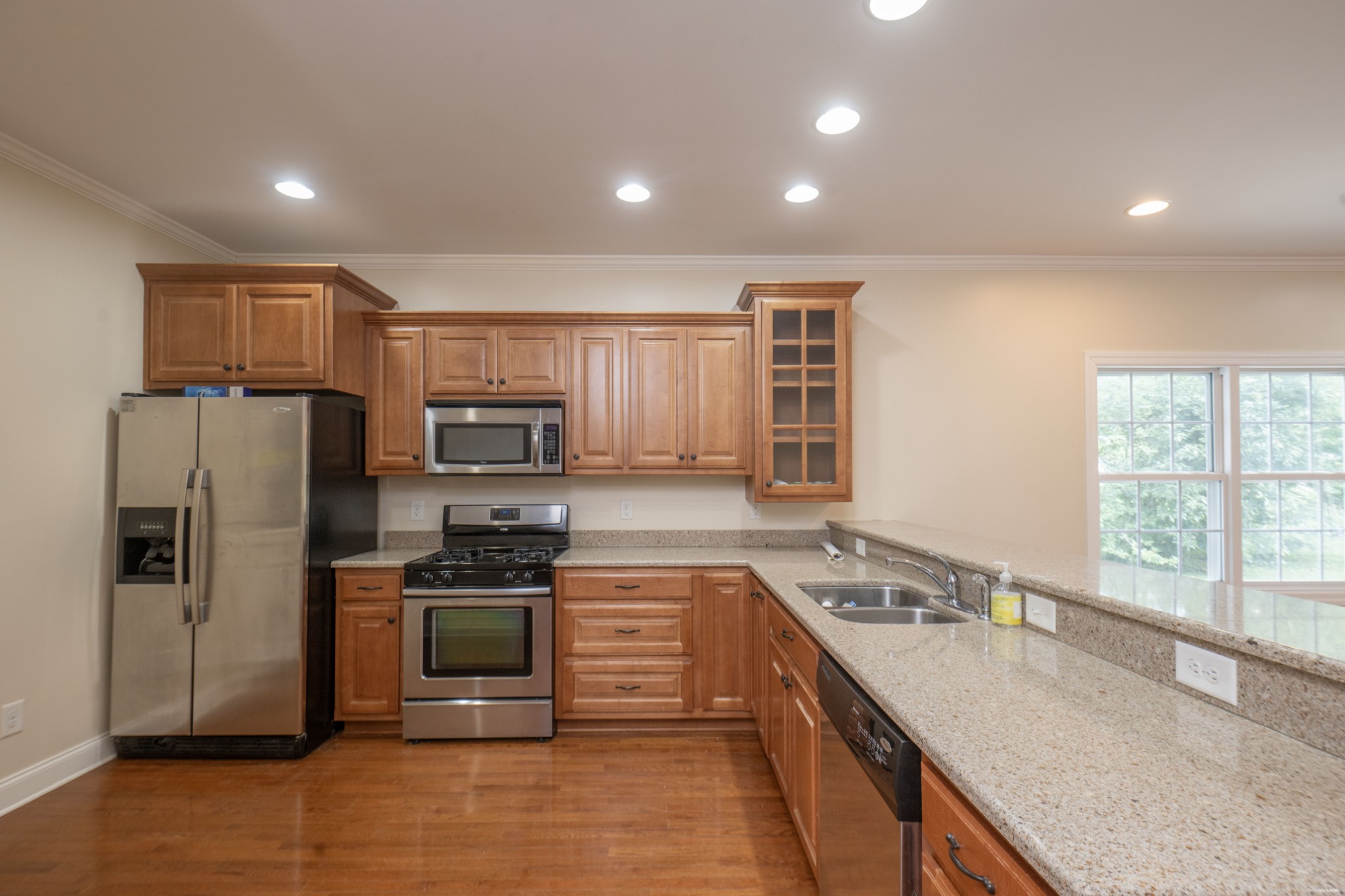 111 Reed's Lane Sewanee, TN 37375 - Photo 5 of 24 a kitchen with stainless steel appliances granite countertop a sink stove and refrigerator