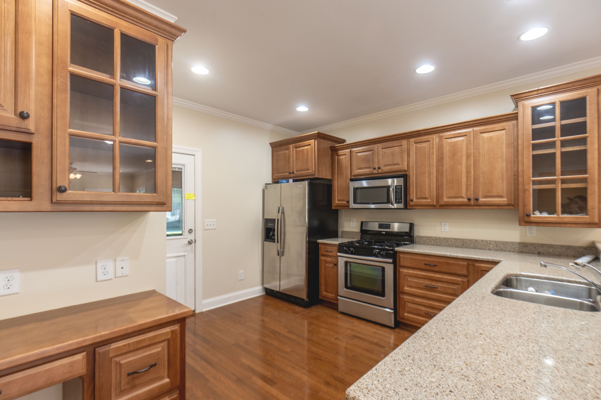 111 Reed's Lane Sewanee, TN 37375 - Photo 6 of 24 a kitchen with granite countertop stainless steel appliances and wooden cabinets