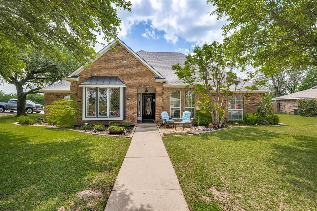 a front view of a house with yard