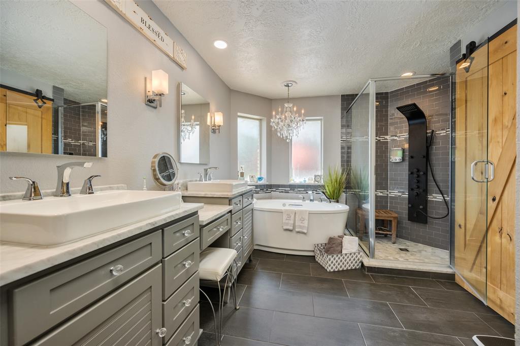 1 Finley Circle Krum, TX 76249 - Photo 15 of 30 a bathroom with a double vanity sink mirror and toilet