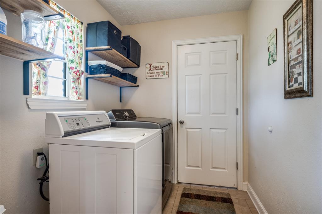 1 Finley Circle Krum, TX 76249 - Photo 21 of 30 a utility room with dryer and washer