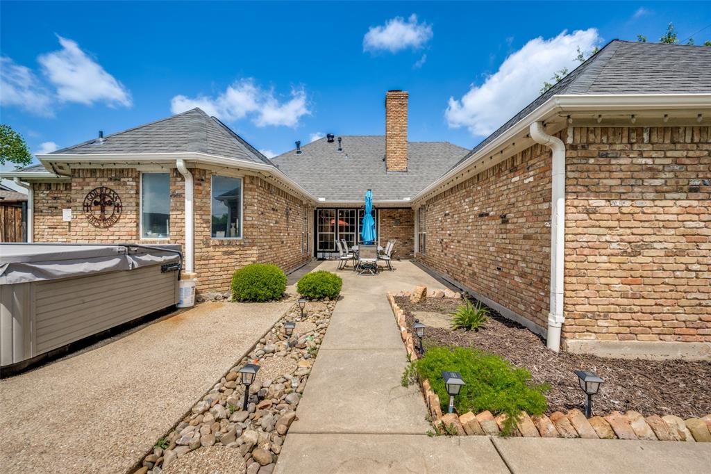 1 Finley Circle Krum, TX 76249 - Photo 24 of 30 a view of a patio with couches under an umbrella