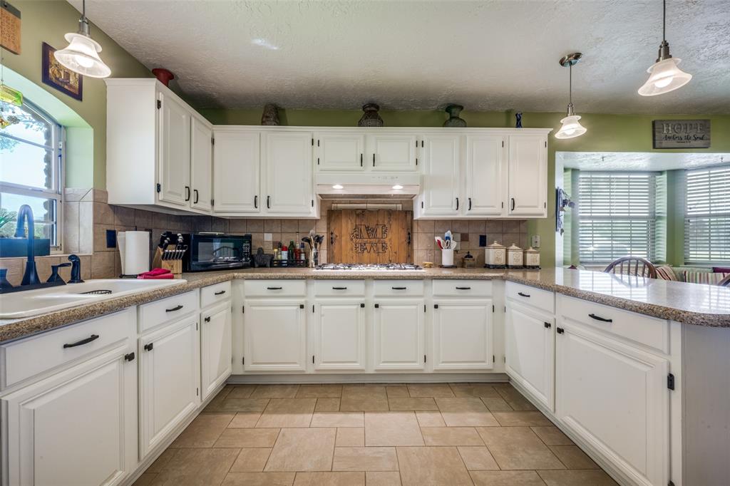 1 Finley Circle Krum, TX 76249 - Photo 8 of 30 a kitchen with cabinets appliances and a window
