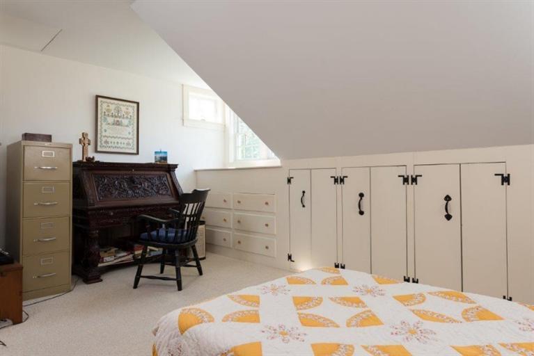24 Champlain Road Chatham, MA 02633 - Photo 14 of 26 a bedroom with a bed and a desk