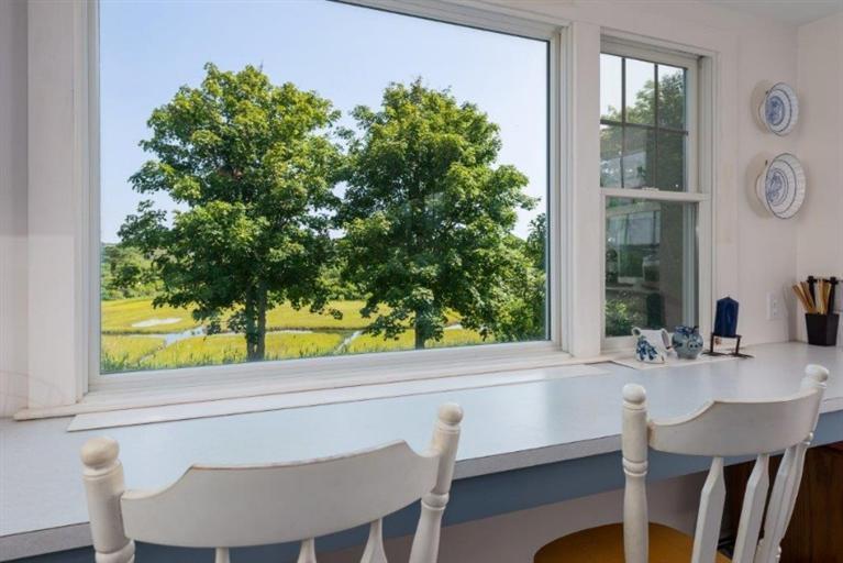 24 Champlain Road Chatham, MA 02633 - Photo 7 of 26 a view of a dining room with furniture and window