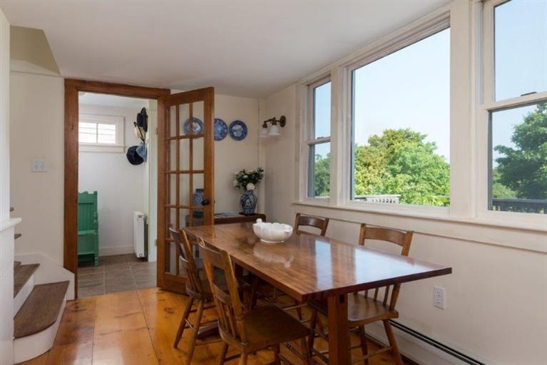 24 Champlain Road Chatham, MA 02633 - Photo 8 of 26 a view of a dining room with furniture window and wooden floor